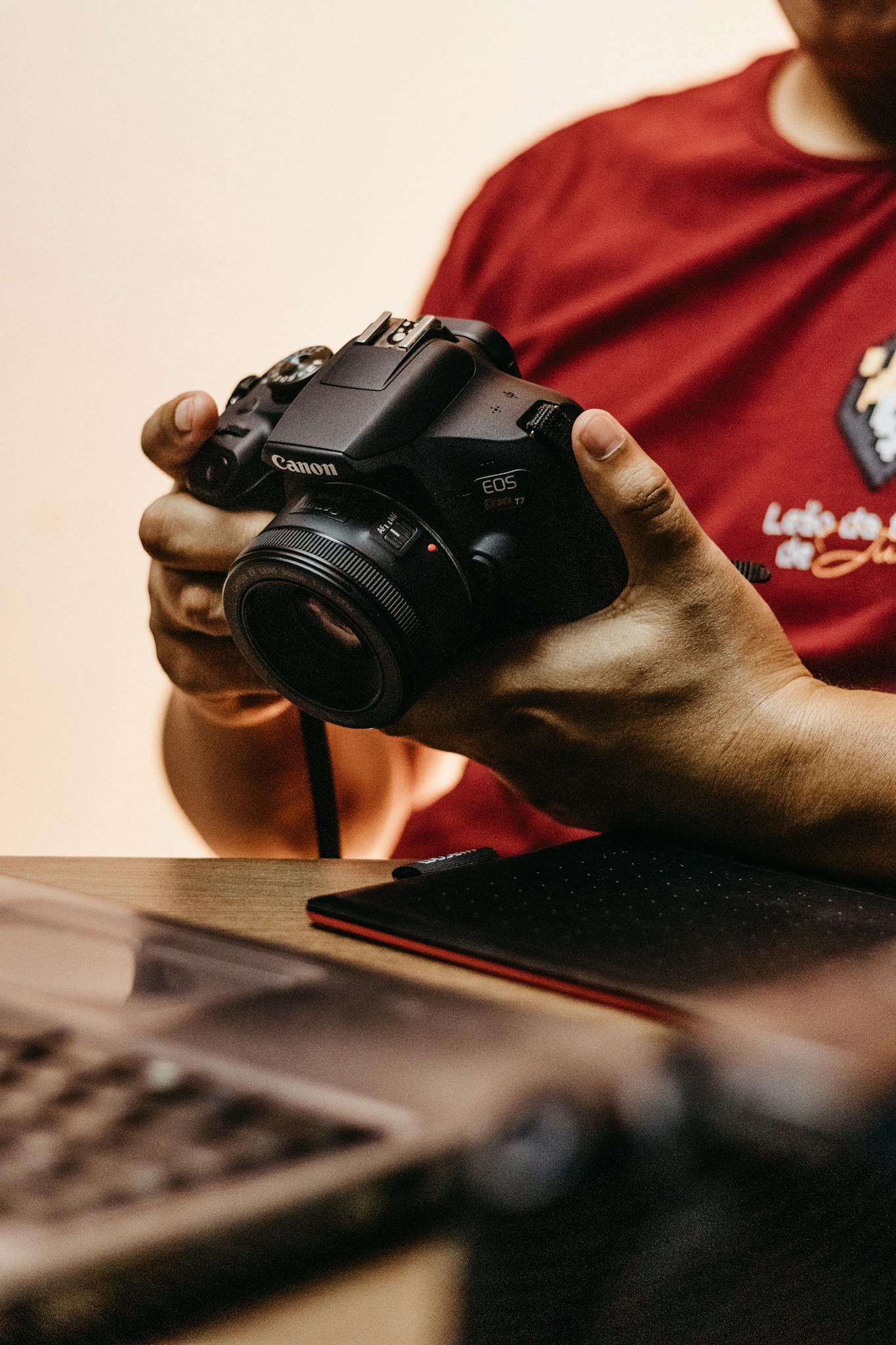 Man Holding Camera in Had